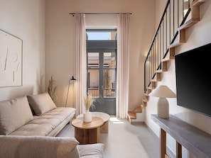 Loft Deluxe | Área de sala de estar | Televisión de pantalla plana, Netflix y servicios de streaming