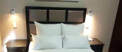 Premium bedding, desk, laptop workspace, free WiFi