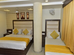 Deluxe Ac Room | Living area | Flat-screen TV