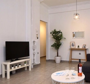 Apartment, 2 Bedrooms | Living area | 20-inch flat-screen TV with cable channels, Smart TV