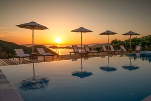 Seasonal outdoor pool, pool umbrellas, pool loungers