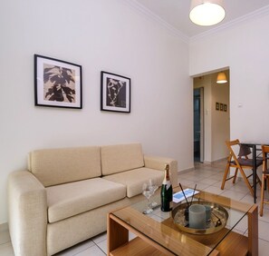 Apartment, 1 Bedroom | Living area | 20-inch flat-screen TV with cable channels, Smart TV