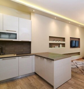 Apartment, 1 Bedroom | Living area | 20-inch flat-screen TV with cable channels, Smart TV