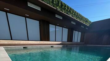 Outdoor pool, open 8:00 AM to 11:00 PM, pool umbrellas, pool loungers
