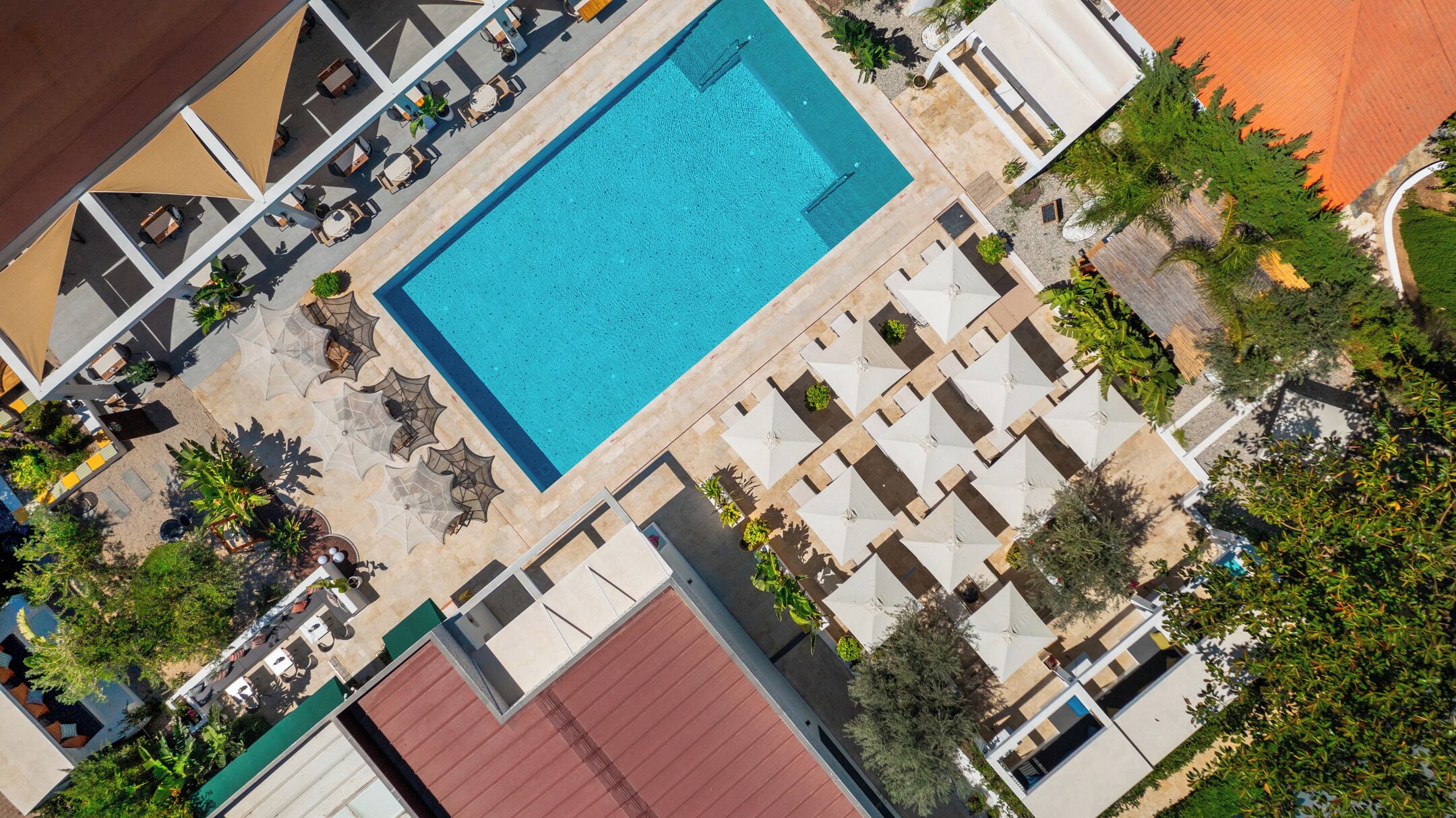 Outdoor pool, open 10:00 AM to 6:00 PM, pool umbrellas, pool loungers