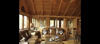 Beautiful Brant Lake home with direct lakefront, hot tub and snowmobile access!