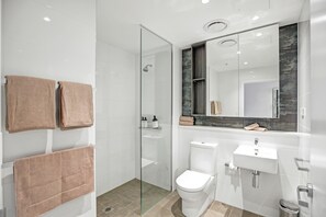 Shower, hair dryer, towels, soap