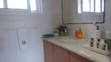 Shower, hair dryer, towels, soap