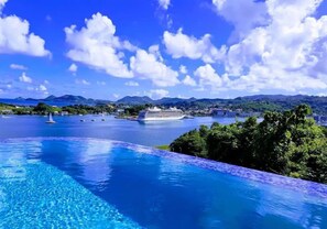 A swimming pool with a view of a cruise ship and mountains in the background. - Ocean Crest (Coral Vista) - 3-Bedroom Sea View Villa! (Castries)