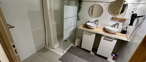 Shower, hair dryer, towels, soap
