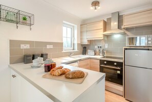 Oven, dishwasher, high chair, cookware/dishes/utensils