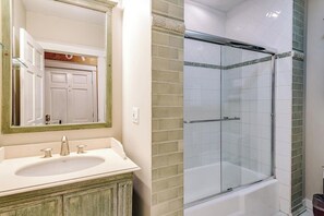 Shower, hair dryer, towels, shampoo