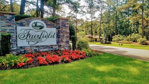 Escape to a serene retreat surrounded by lush greenery and mature trees.