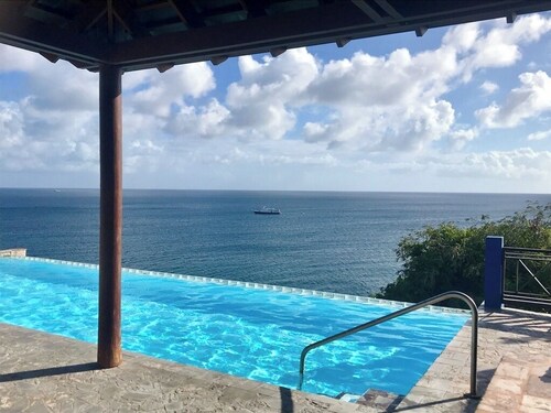 Lovely hillside villa overlooking the Caribbean Sea with private plunge pool.