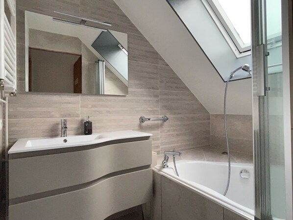 Bathtub, hair dryer, towels, soap