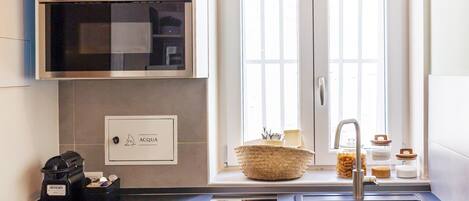 Fridge, microwave, stovetop, coffee/tea maker