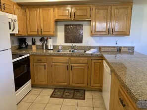 Microwave, dishwasher, coffee/tea maker, cookware/dishes/utensils