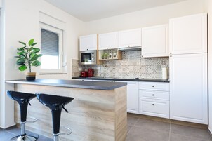 Apartment, 2 Bedrooms | Private kitchen | Espresso maker, full-sized fridge, stovetop, electric kettle