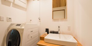 Combined shower/tub, free toiletries, hair dryer, slippers