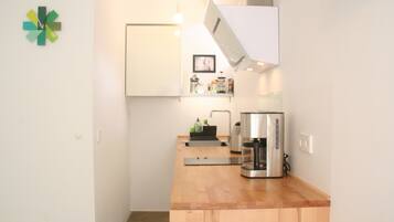 Fridge, stovetop, dishwasher, coffee/tea maker