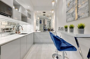 Fridge, coffee/tea maker, electric kettle, cookware/dishes/utensils