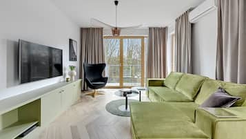 Premium Apartment | Living room | Flat-screen TV