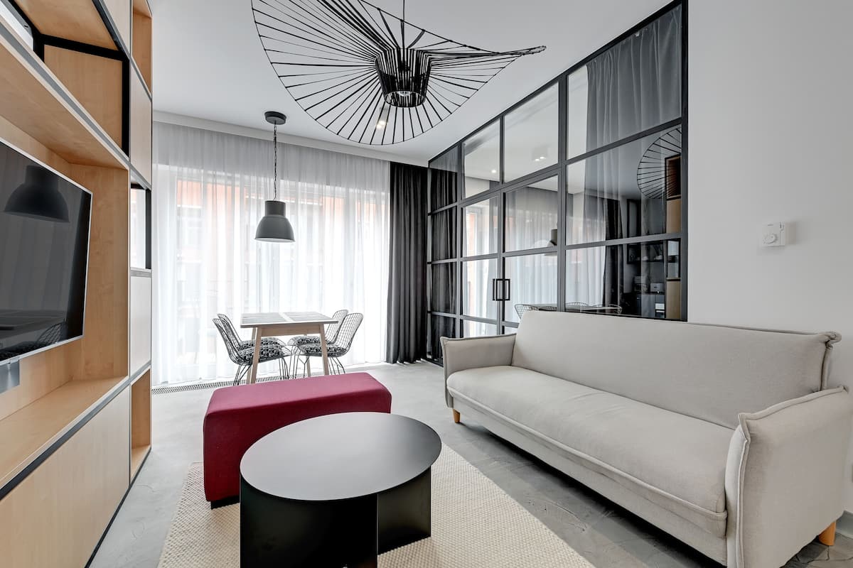 Design Apartment, 1 Bedroom | Living area | 30-cm flat-screen TV with cable channels, TV
