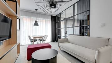 Design Apartment, 1 Bedroom | Living area | 30-cm flat-screen TV with cable channels, TV