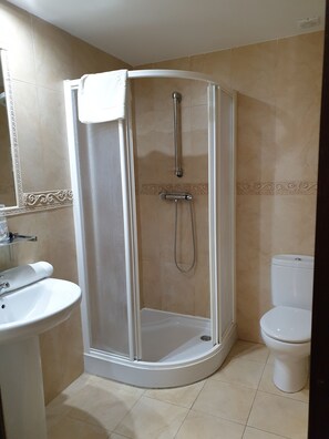 Shower, rainfall showerhead, towels