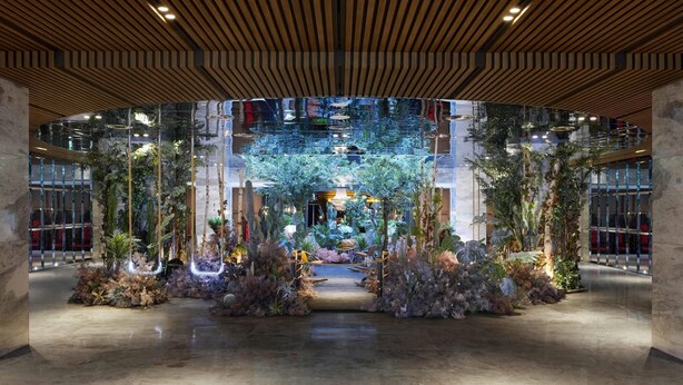 A spacious atrium with a central garden, wooden ceiling panels, and a reflective glass wall. - Mondrian Seoul Itaewon (Seoul)