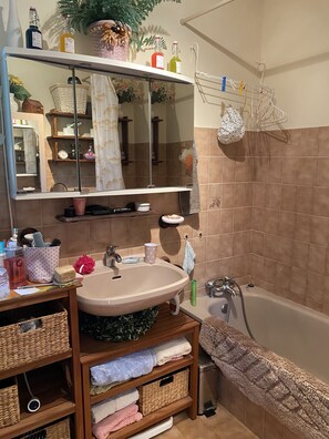 Bathtub, hair dryer, towels, soap