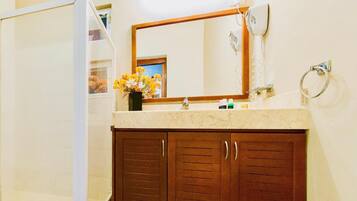 Shower, hair dryer, towels, toilet paper