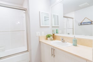 Combined shower/tub, hair dryer, towels, soap