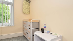 A child's room with a desk, storage unit, and a window with blinds. - Townhouse @ 178 Ruskin Road Crewe (Crewe)