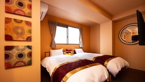 A hotel room with two beds, a large window with curtains, a round mirror, and three wall-mounted artworks. - The L.A. Mart Hotel Kyoto (Kyoto)