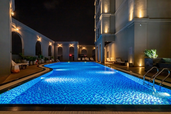 Outdoor pool, open 6:00 AM to 7:00 PM, pool umbrellas, pool loungers
