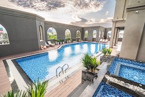 Outdoor pool, open 6:00 AM to 7:00 PM, pool umbrellas, sun loungers