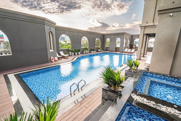 Outdoor pool, open 6:00 AM to 7:00 PM, pool umbrellas, sun loungers - The Cap Hotel (Ho Chi Minh City)