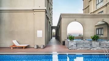 Outdoor pool, open 6:00 AM to 7:00 PM, pool umbrellas, sun loungers