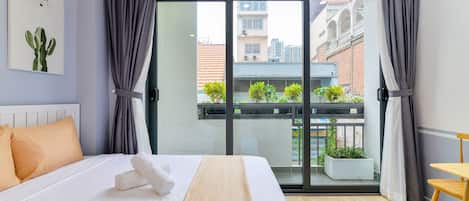 Deluxe Studio, 1 Queen Bed, Non Smoking, Balcony | Minibar, desk, laptop workspace, blackout drapes