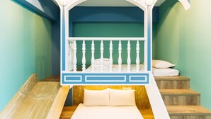 A bedroom with a bed, a wooden bench, and a staircase. - Flower Young B&B (Hualien City)