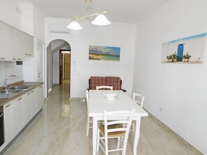 Dining - Central Apartment by the Ionian Seaside with Balcony, Sea View & Air Conditioning (Torre San Giovanni)