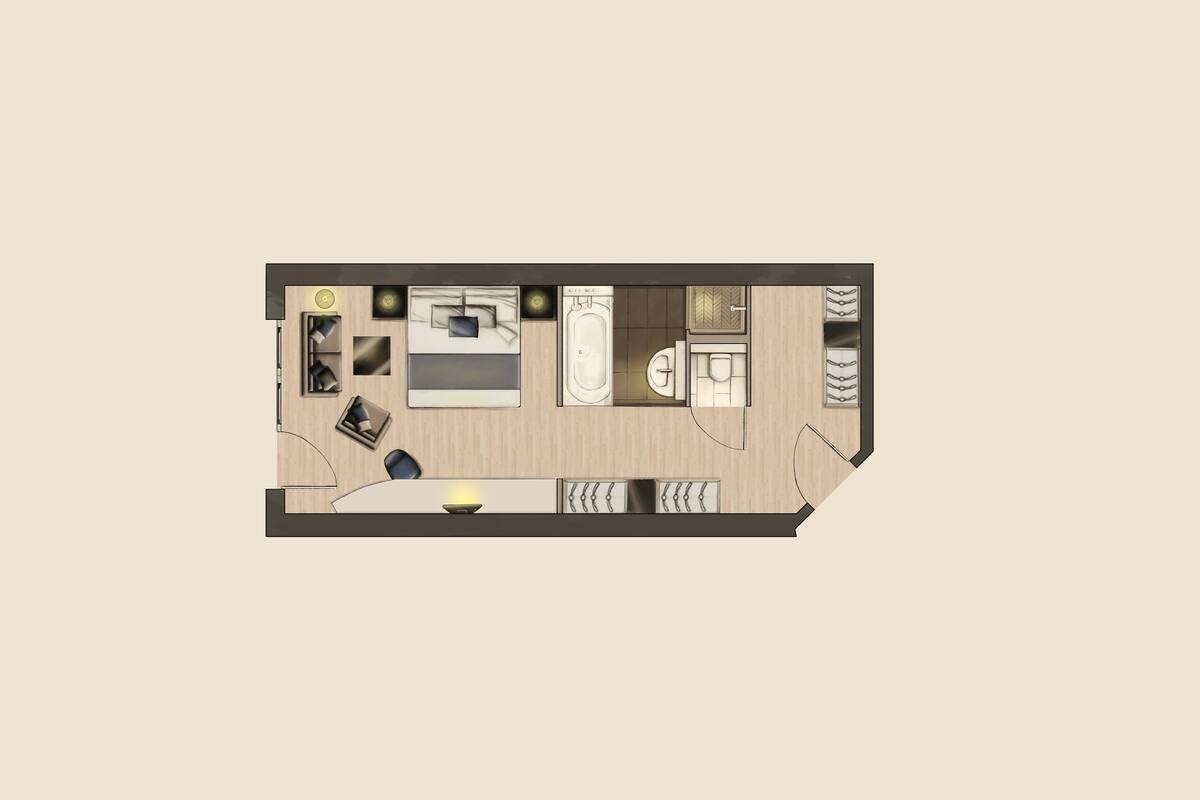 Planta baixa de um quarto de hotel com cama, escrivaninha, cadeira, sofá, banheiro e um pequeno espaço de estar.