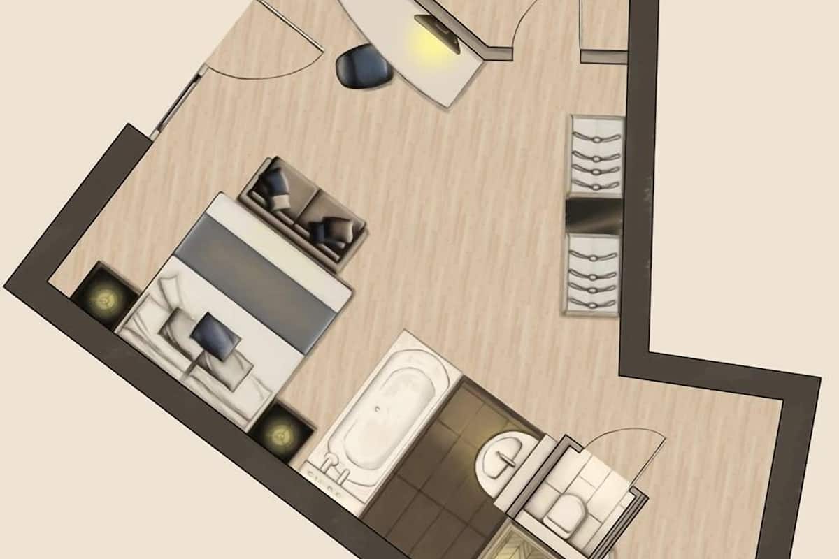 Planta de um apartamento de dois quartos, com cozinha, sala de jantar e uma pequena sala de estar.