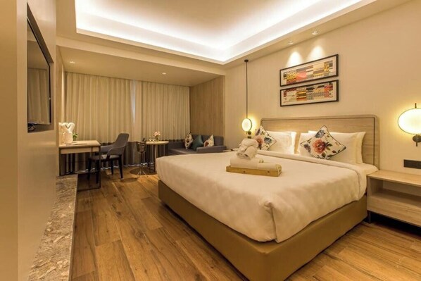 Untuvapeitot, pillowtop-patjalliset sängyt, minibaari