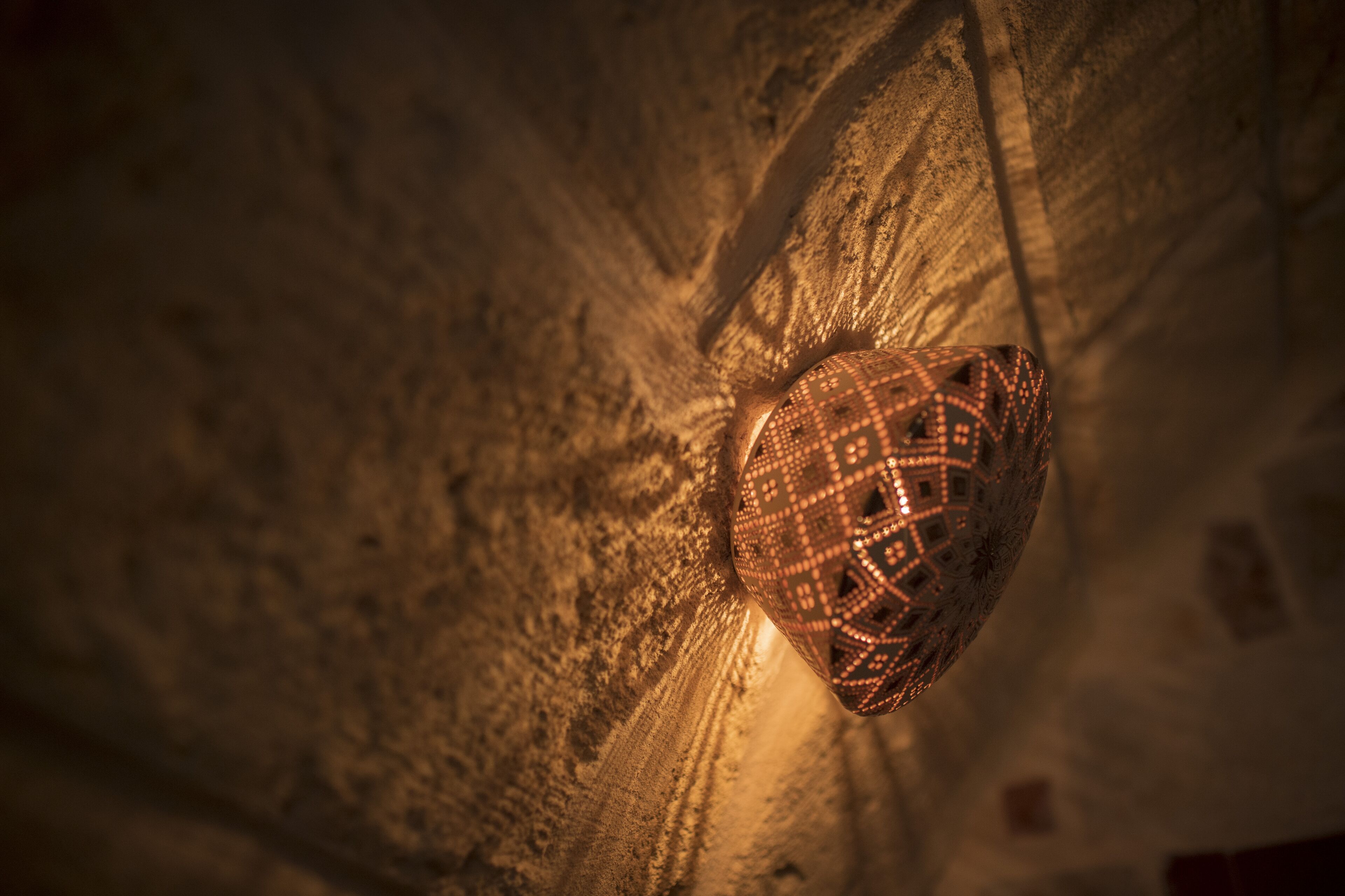 A ceiling with a patterned light fixture.