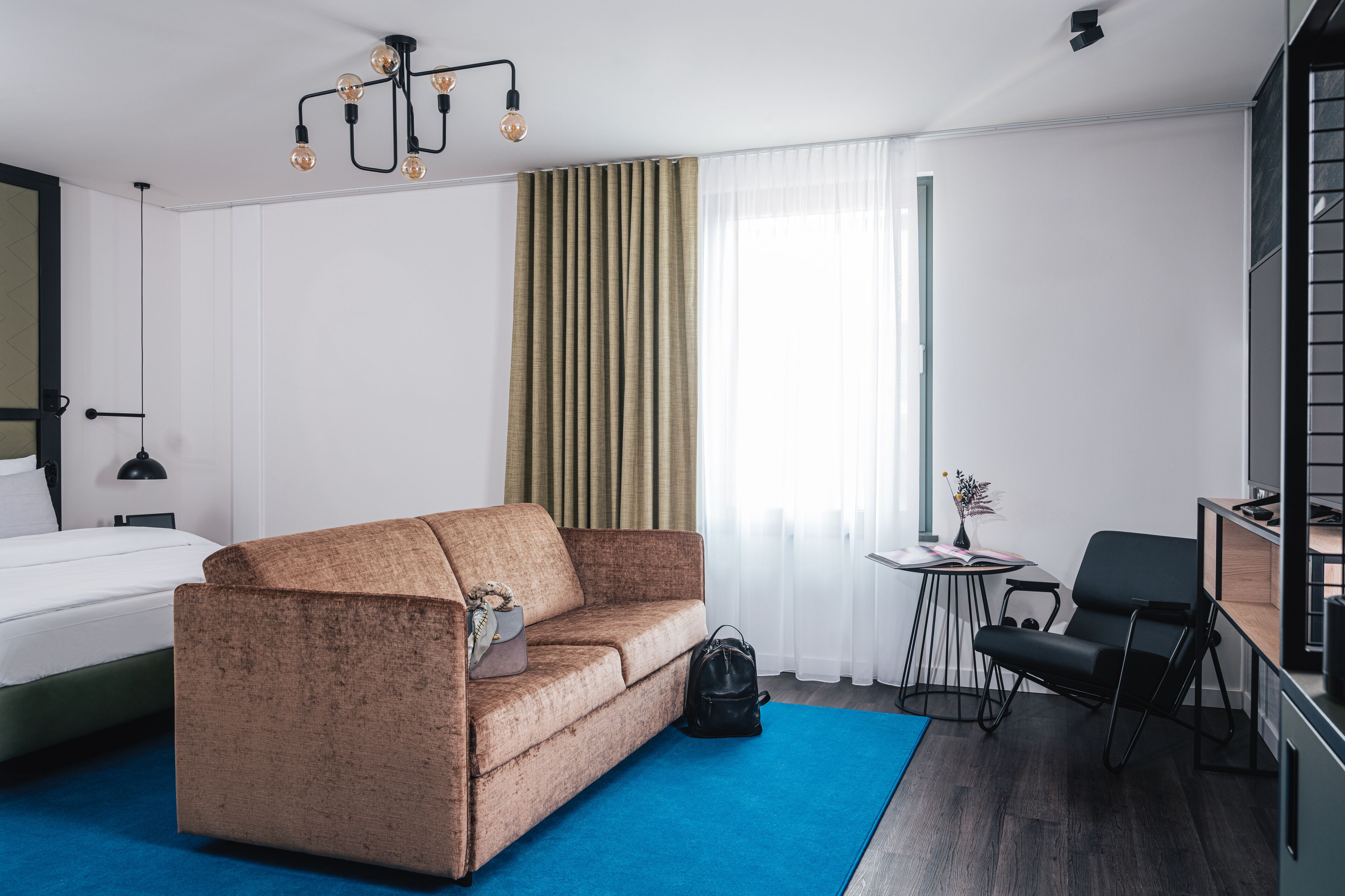 premium double room | living area | 55-inch flat-screen tv with cable channels, tv, tablet