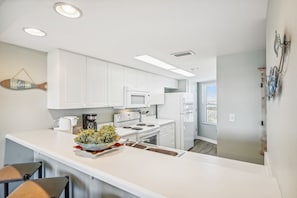 Condo, 3 Bedrooms | Private kitchen | Fridge, coffee/tea maker, toaster - Seacrest 715AB is a 3 BR on the Gulf side of Okaloosa Island by RedAwning (Fort Walton Beach)