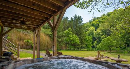 Woodsy Retreat with Hot Tub | Dogs Welcome | On River Time