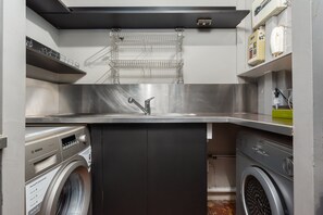 Convenient laundry facilities feature a washer, dryer, and sink.